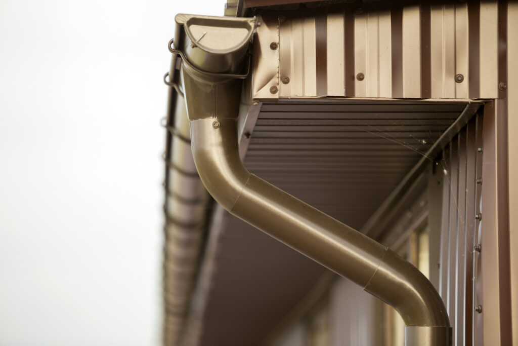 Seamless gutter and downspout system installed on a home